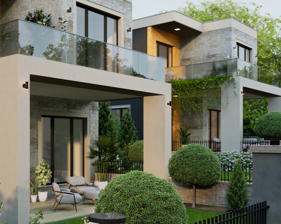 Modern concrete townhouses with deep balconies and planted terraces